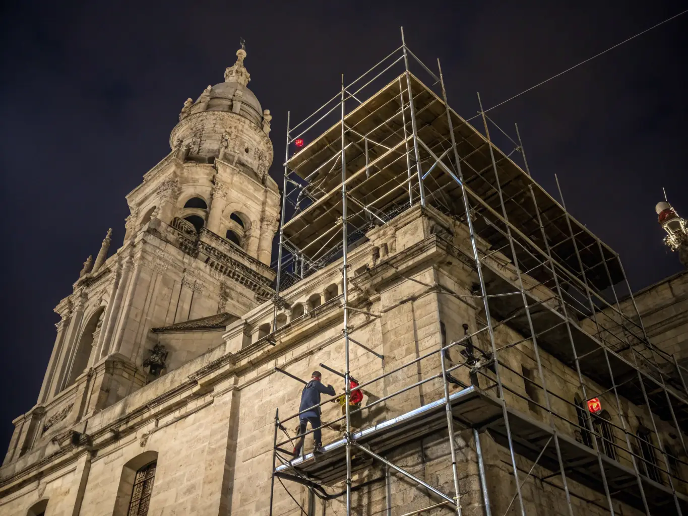 A photograph showcasing the meticulous restoration of a historical building's facade, emphasizing the intricate details and craftsmanship involved in preserving Canadian architectural heritage.